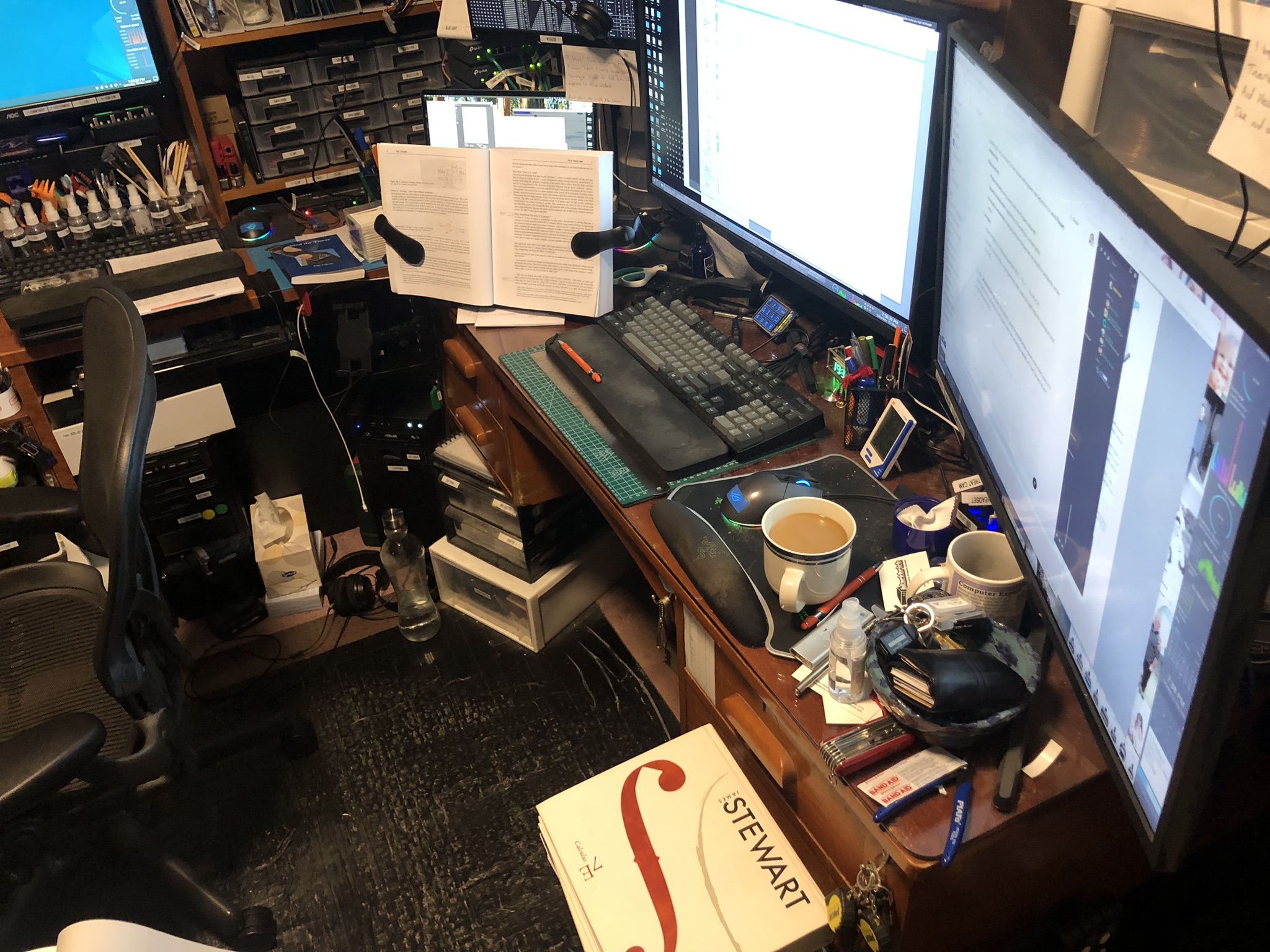 John's desk with his Learning the Art of Electronics book open