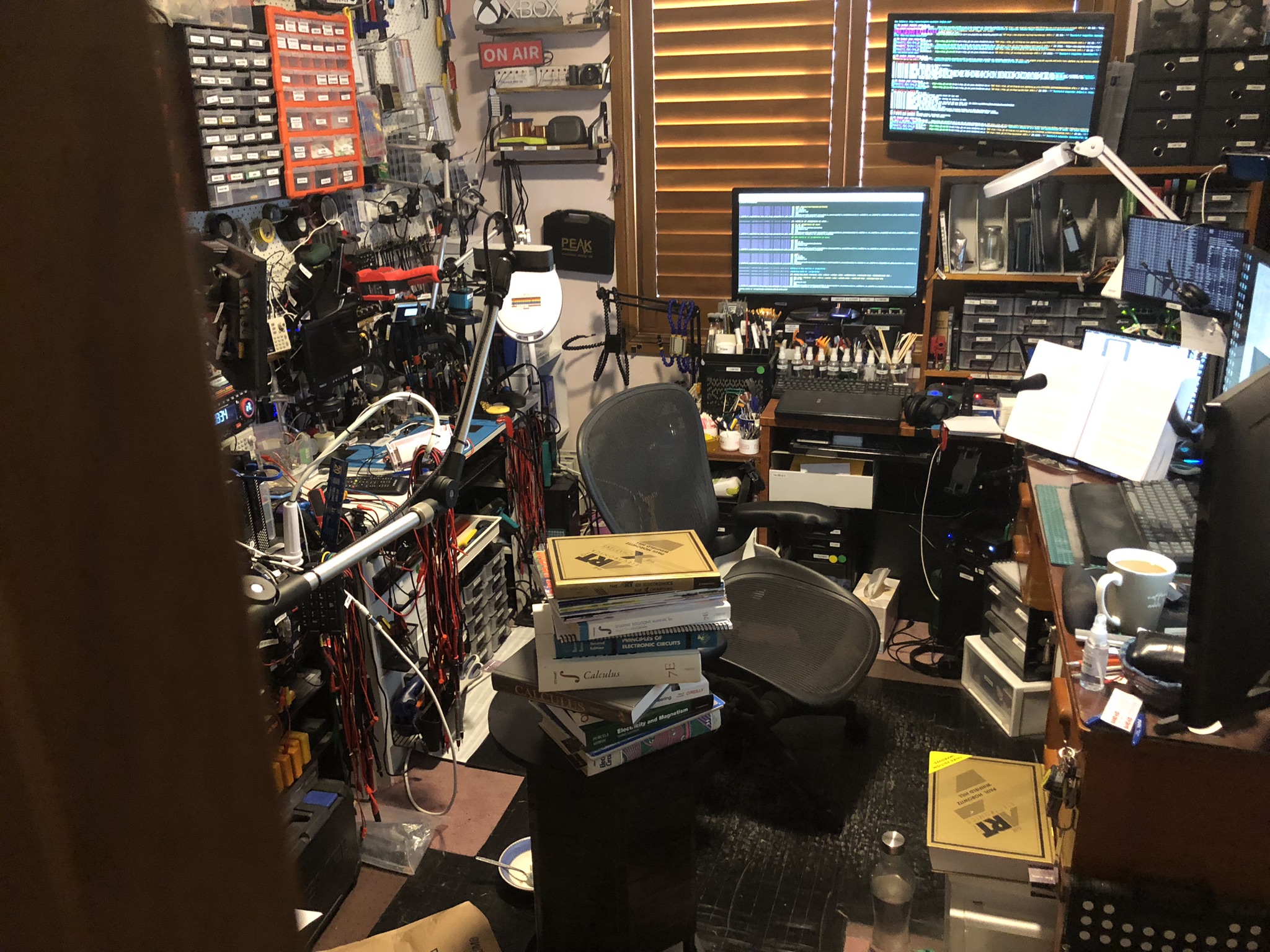 John's room with a bunch of his books out